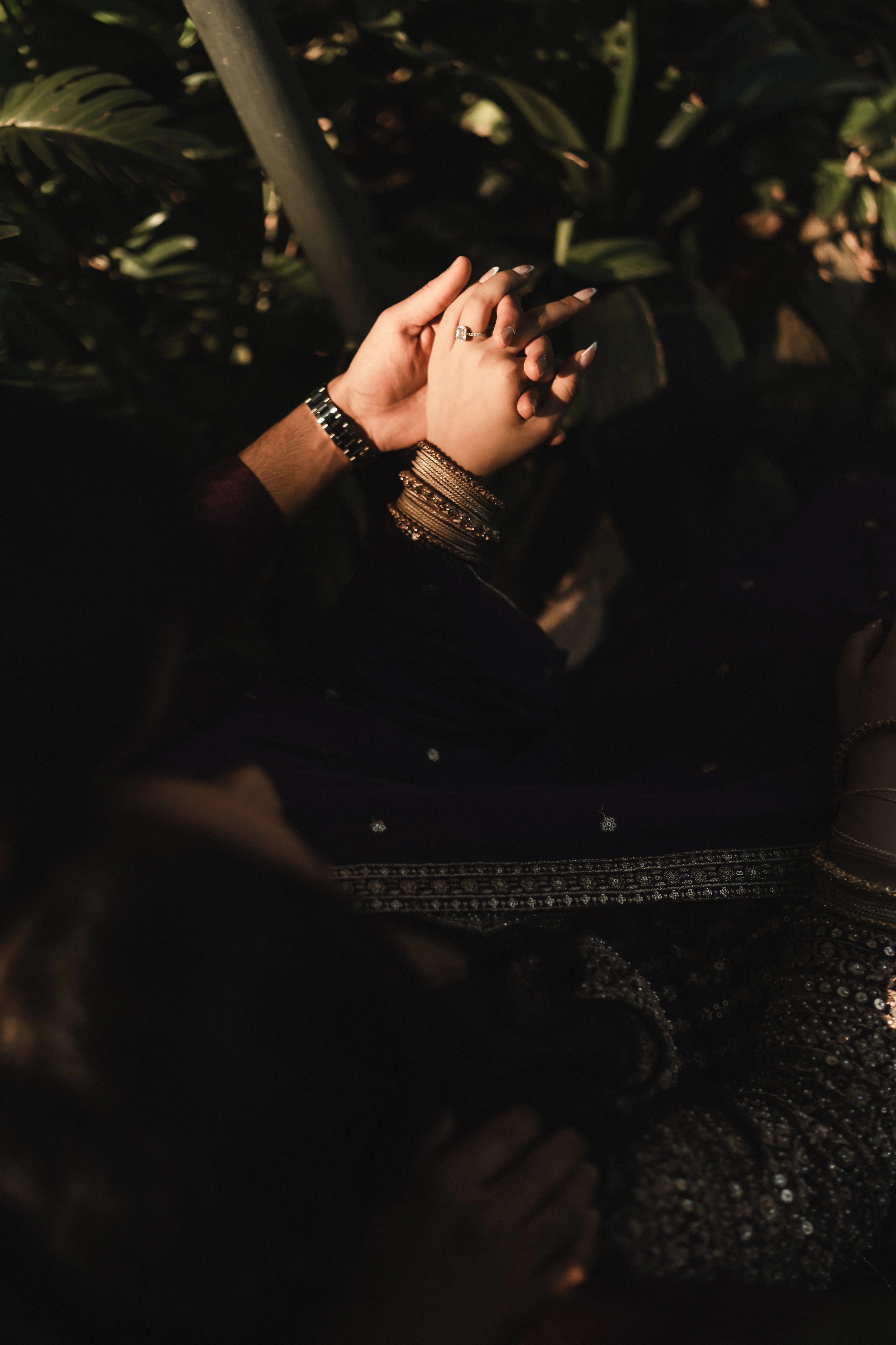 Hands joined with bangles in cinematic light