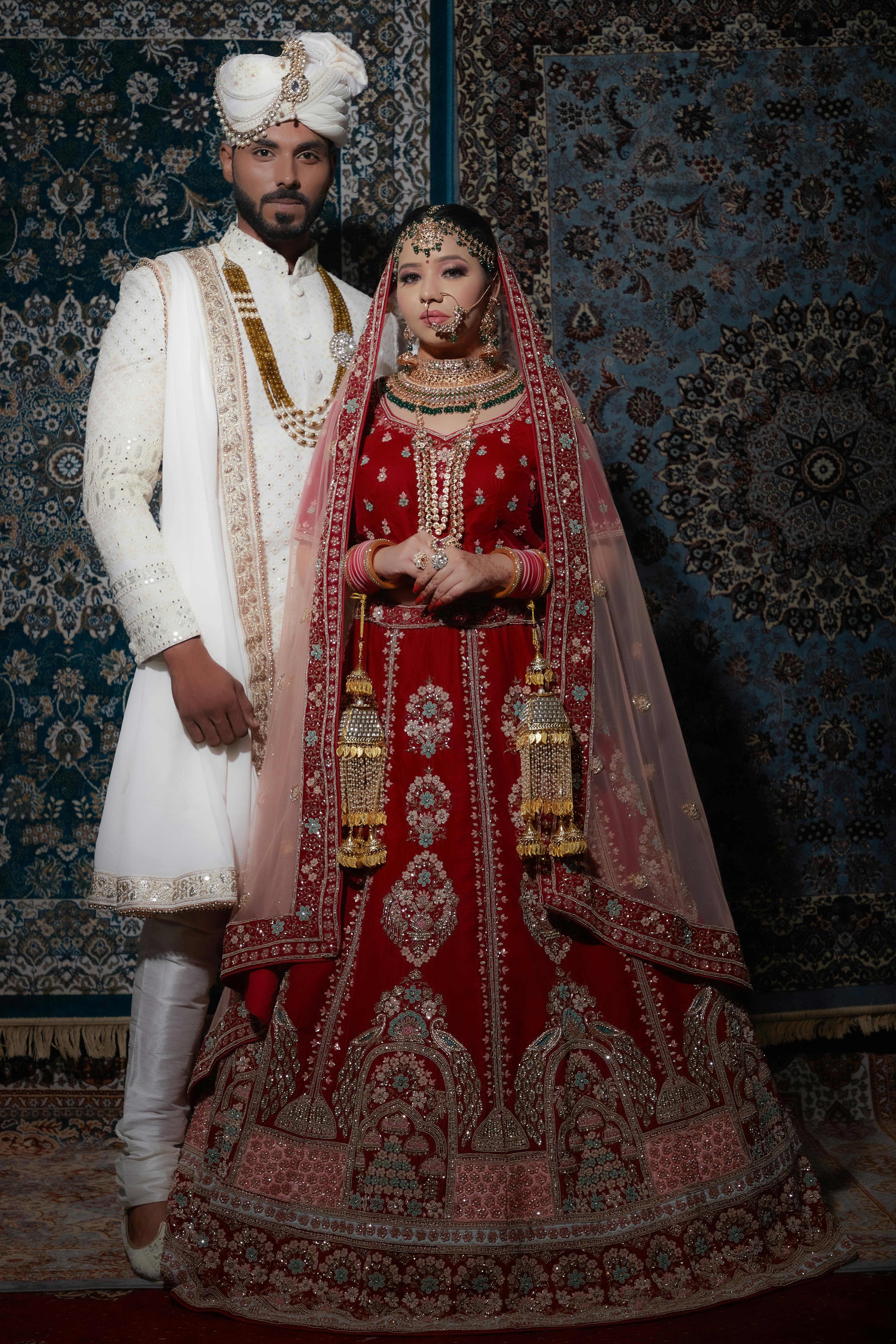 A South Asian bride and groom in formal portrait